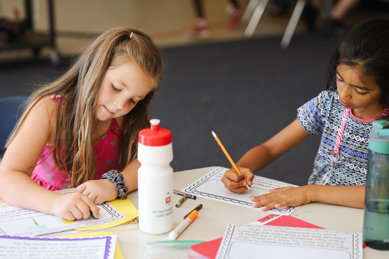 Photo of two LiftED program participants drawing at a desk